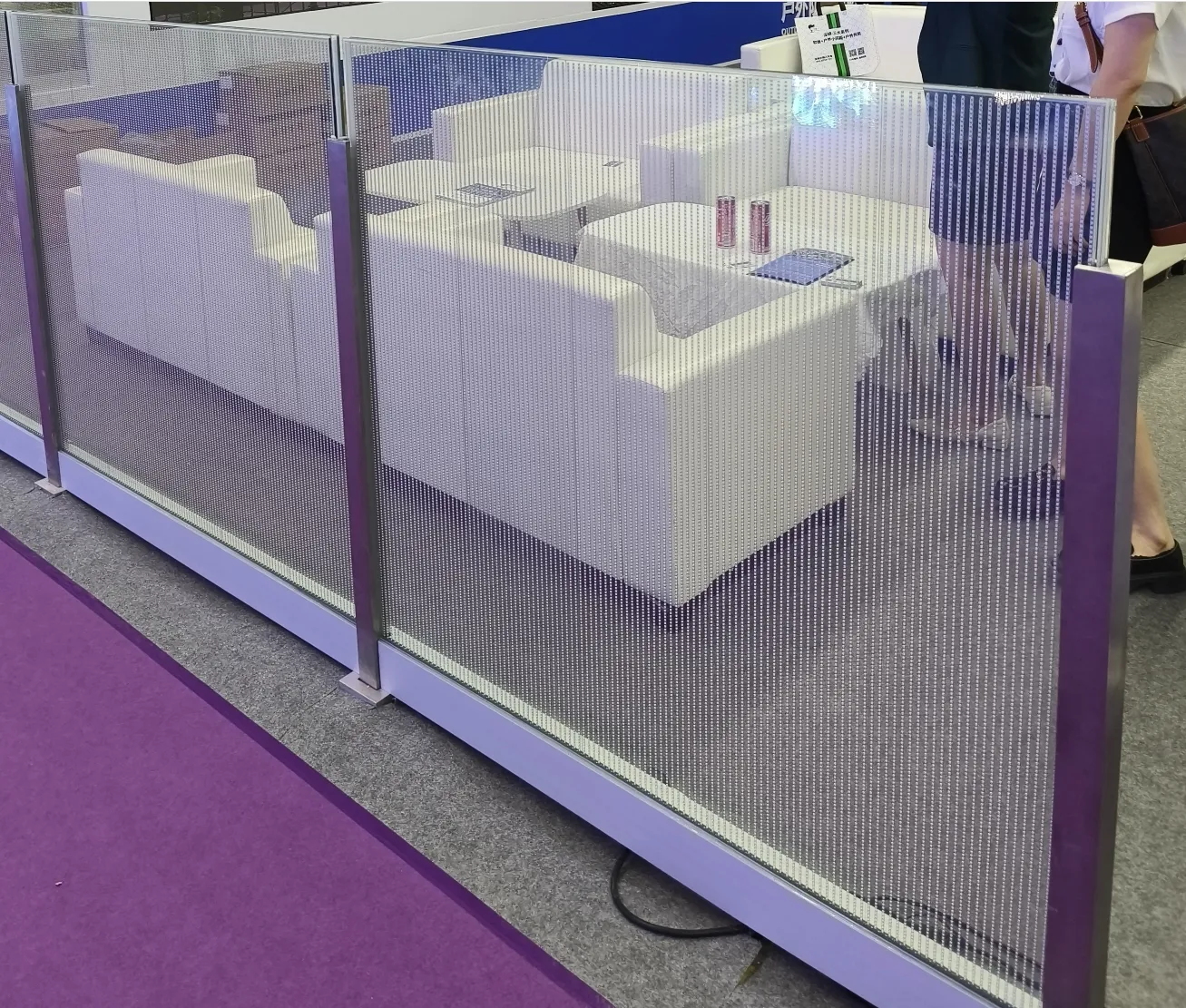 Transparent LED guardrail panels at an exhibition booth