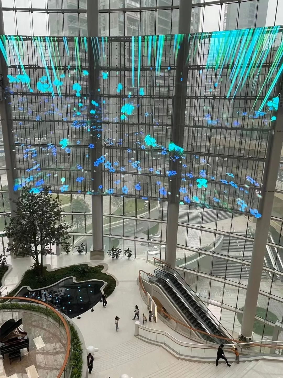 Transparent LED screen across a glass atrium
