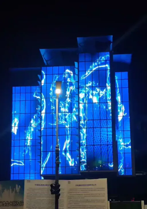 High-rise facade with electric blue holographic visuals